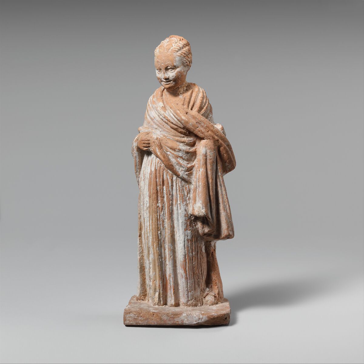 Terracotta statuette of a standing girl, Terracotta, Greek, Attic