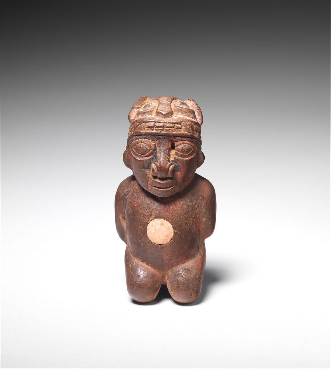 Lime container in the shape of a captive, Wari artist(s), Wood, animal bone, paint, fiber, Wari