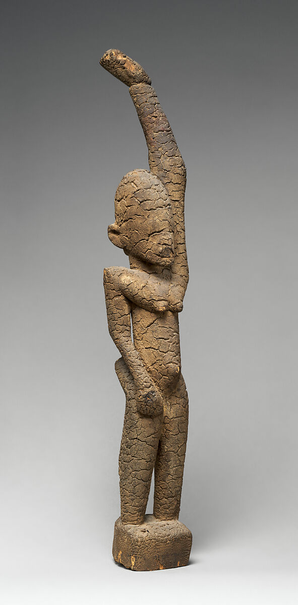 Female figure with raised arm, Tellem blacksmith, Wood (Moraceae family), applied organic materials, Tellem civilization (?)