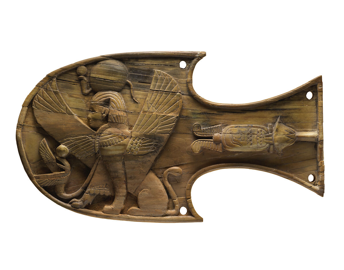 Horse blinker carved in relief with a seated sphinx, Ivory, Assyrian