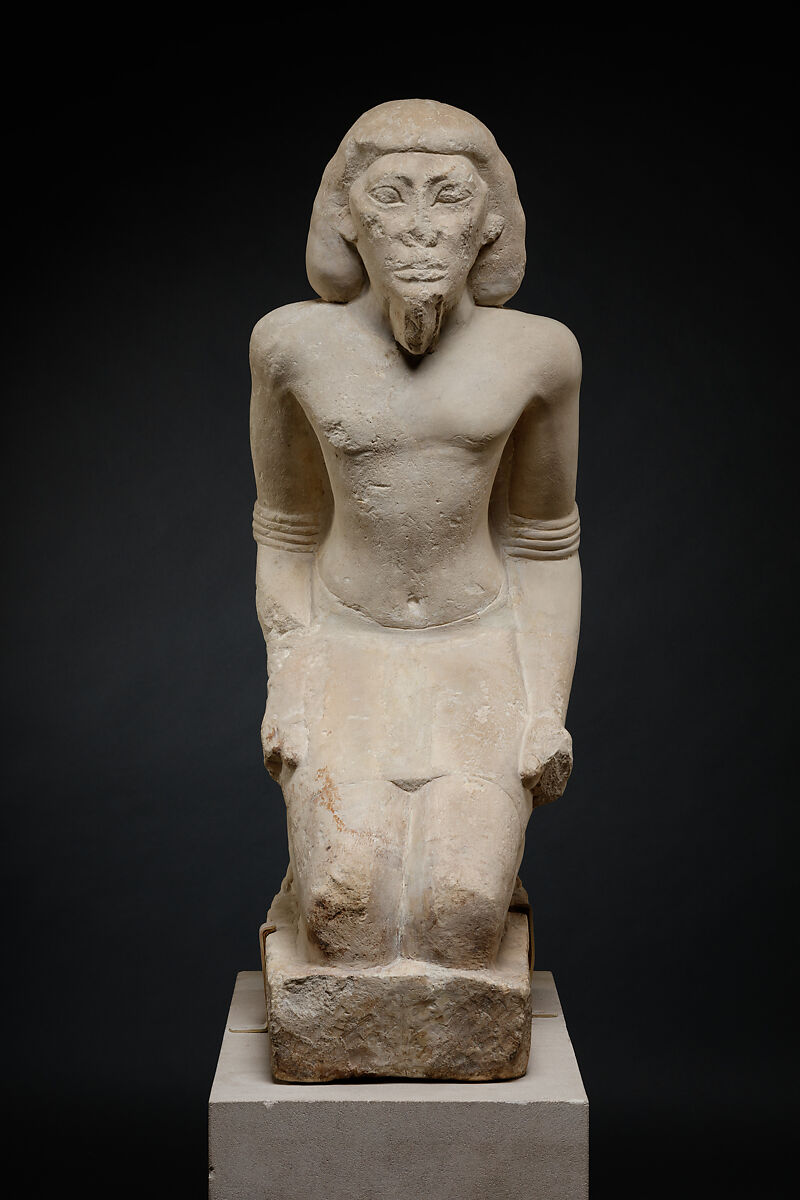 Kneeling captive, Limestone, paint
